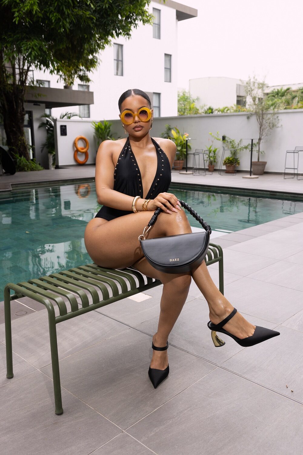 Kathya Ezenwafor poolside luxury lifestyle portrait